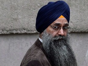 Inderjit Singh Reyat waits outside the B.C. Supreme Court, in Vancouver, on September 10, 2010. Reyat, the only person convicted in the 1985 Air India bombings, has been granted a statutory release from prison to a halfway house.