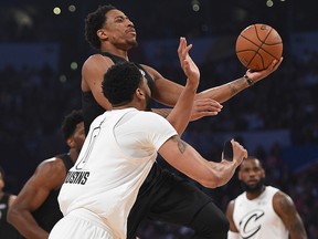 DeMar Derozan of Team Stephen drives past Anthony Davis, wearing Demarcus Cousins' jersey, of Team LeBron during the NBA All-Star Game at Staples Center on February 18, 2018 in Los Angeles. (Kevork Djansezian/Getty Images)