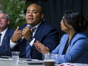 Liberal leadership contender Michael Coteau (holding microphone)