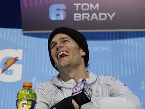 New England Patriots quarterback Tom Brady laughs during Super Bowl 52 Opening Night Monday, Jan. 29, 2018, at the Xcel Center in St. Paul, Minn. (AP Photo/Matt Slocum)