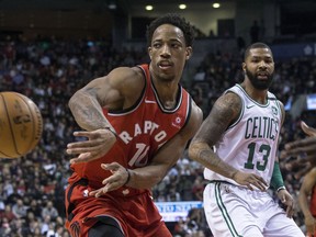 Raptors' DeMar DeRozan looks to make a pass against the Celtics at the ACC on Tuesday night. THE CANADIAN PRESS/Chris Young