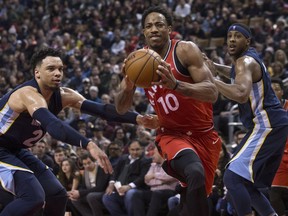 Toronto Raptors guard DeMar DeRozan (10) drives past Memphis Grizzlies forward Dillon Brooks (24) during first half NBA basketball action in Toronto on Sunday, February 4, 2018. THE CANADIAN PRESS