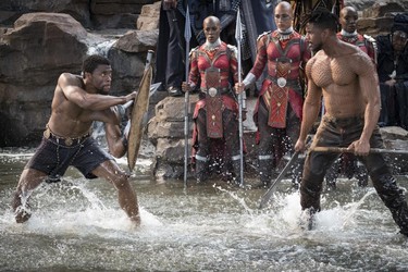 This image released by Disney shows Chadwick Boseman and Michael B. Jordan in a scene from Marvel Studios' "Black Panther." (Matt Kennedy/Marvel Studios-Disney)
