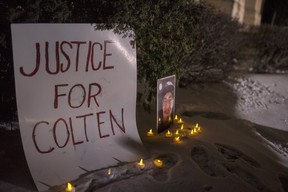 A sign and photo of Colten Boushie sits in front of the Court of Queen’s Bench on the day of closing arguments and first day of jury deliberation in the trial of Gerald Stanley, the farmer accused of killing the 22-year-old Indigenous man, in Battleford, Sask., Thursday, February 8, 2018.
