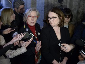 Minister of Crown-Indigenous Relations and Northern Affairs Carolyn Bennett, left, and Minister of Indigenous Services Jane Philpott speak to reporters.