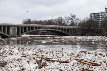 Ice is seen in the high waters of the Grand River in Brantford where residents were being evacuated due to flooding after an ice jam upstream of Parkhill Dam sent a surge of water downstream on Wednesday, February 21, 2018. THE CANADIAN PRESS/Aaron Vincent Elkaim