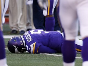 In this Nov. 8, 2015, file photo, Minnesota Vikings quarterback Teddy Bridgewater lies on the field after a hit against the St. Louis Rams, in Minneapolis. (AP Photo/Ann Heisenfelt, File)
