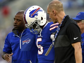 In this Aug. 26, 2017, file photo, Buffalo Bills quarterback Tyrod Taylor (5) is assisted off the field after being sacked during a preseason NFL game in Baltimore. (AP Photo/Gail Burton, File)