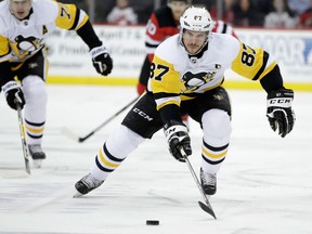 Pittsburgh Penguins centre Sidney Crosby skates after the puck during the first period of an NHL hockey game against the New Jersey on Feb. 3, 2018