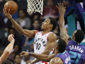 Raptors guard DeMar DeRozan (10) shoots against the Hornets during first half NBA action in Charlotte, N.C., on Sunday, Feb. 11, 2018.