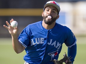 Toronto Blue Jays second baseman Devon Travis blows a bubble during a rundown drill at spring training in Dunedin, Fla. on Tuesday, February 20, 2018. (THE CANADIAN PRESS/Frank Gunn)