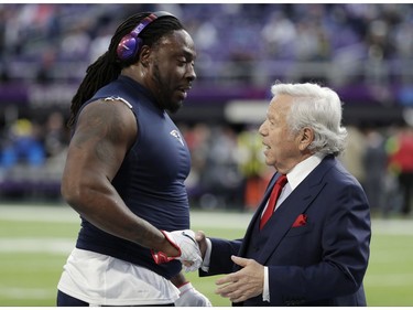 New England Patriots owner Robert Kraft, right, greets defensive tackle Ricky Jean Francois, before the NFL Super Bowl 52 football game against the Philadelphia Eagles Sunday, Feb. 4, 2018, in Minneapolis.