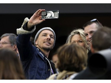 Actor Dax Shepard, left, takes selfie on the sideline, before the NFL Super Bowl 52 football game between the Philadelphia Eagles and the New England Patriots Sunday, Feb. 4, 2018, in Minneapolis.