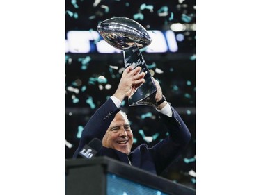 Philadelphia Eagles owner Jeffrey Lurie hoists the Vince Lombardi Trophy after his team won the NFL Super Bowl 52 football game against the New England Patriots Sunday, Feb. 4, 2018, in Minneapolis. The Eagles won 41-33.
