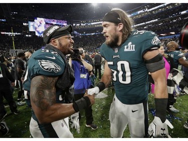 Philadelphia Eagles outside linebacker Najee Goode (52) and defensive end Bryan Braman (50), celebrate after the NFL Super Bowl 52 football game against the New England Patriots Sunday, Feb. 4, 2018, in Minneapolis. The Eagles won 41-33.
