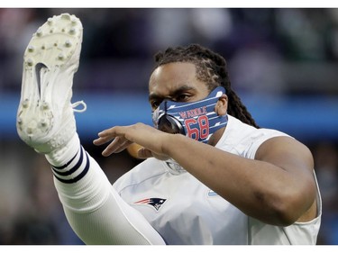 New England Patriots offensive tackle LaAdrian Waddle, warms up before the NFL Super Bowl 52 football game against the Philadelphia Eagles, Sunday, Feb. 4, 2018, in Minneapolis.