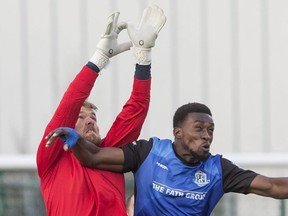 Jacksonville Armada goalkeeper Caleb Patterson-Sewell defends FC Edmonton Tomi Ameobi at Clarke Park, in Edmonton April 8, 2017. AMBER BRACKEN/POSTMEDIA