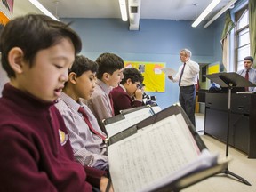 Peter Mahon, Senior Choir Conductor, leads a class at St. Michael's Choir School in Toronto, Ont. on Tuesday February 13, 2018.