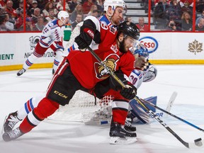 Derick Brassard and Michael Grabner, battling  for the puck, both found themselves on new teams late this past week as the NHL trade deadline began to pick up steam. (Photo by Francois Laplante/NHLI via Getty Images)