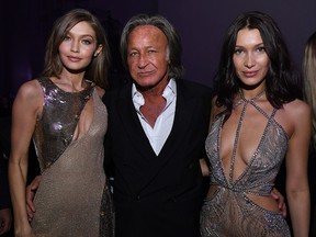 (L-R) Gigi Hadid, Mohamed Hadid and Bella Hadid attend the Victoria's Secret After Party at the Grand Palais on Nov. 30, 2016 in Paris, France. (Photo by Dimitrios Kambouris/Getty Images for Victoria's Secret)