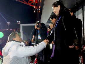 North Korean Leader Kim Jong Un's sister Kim Yo Jong (R) shakes hands with South Korean President Moon Jae-in (C) during the opening ceremony of the Pyeongchang 2018 Winter Olympic Games in Pyeongchang on Feb. 9, 2018. (AFP/Getty Images)