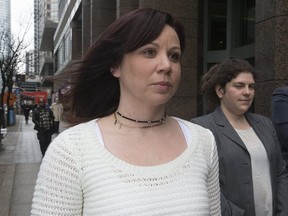 Toronto Police Const. Heather McWilliam leaves the Ontario Human Rights Tribunal with her lawyers during a lunch break in Toronto on Monday, March 27, 2017.