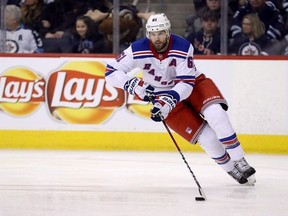 The New York Rangers have traded forward Rick Nash to the Boston Bruins for a 2018 first-round draft pick, defenceman Ryan Lindgren, forwards Ryan Spooner and Matt Beleskey, and a seventh-round pick in the 2019 draft. New York Rangers' Rick Nash (61) carries the puck during second period NHL hockey action against the Winnipeg Jets in Winnipeg, Sunday, February 11, 2018.