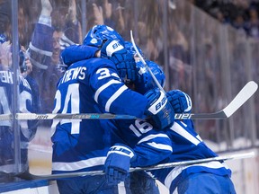 Toronto Maple Leafs forwards Auston Matthews, Mitch Marner and William Nylander celebrate a goal against the Tampa Bay Lightning on Feb. 12, 2018