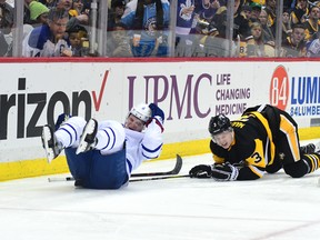 Maple Leafs forward Zach Hyman crashes into the boards against the Penguins on Saturday in Pittsburgh. (Getty Images)