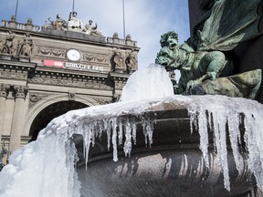 The icy Alfred Escher fountain is pictured in Zurich, Switzerland, Wednesday, Feb. 28, 2018.(Melanie Duchene/Keystone via AP)