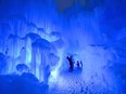 Visitors check out the caverns, slides and tunnels at Ice Castles' a fantasy playground made almost entirely of ice.