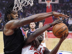 Los Angeles Clippers centre DeAndre Jordan blocks the shot of Chicago Bulls guard Jerian Grant last week. (AP PHOTO)