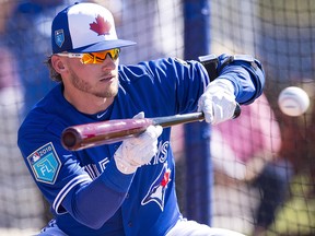 Toronto Blue Jays third baseman Josh Donaldson works on bunting during spring training in Dunedin, Fla. on Monday, February 19, 2018. (THE CANADIAN PRESS/Frank Gunn)