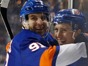 Tavares and Tanner Fritz after a goal against the Wild on Feb. 19, 2018 (THE ASSOCIATED PRESS)
