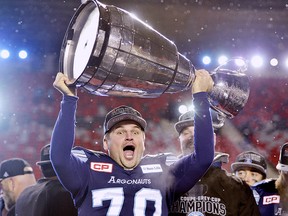 Argonauts kicker Lirim Hajrullahu (70) celebrates as he hoists the Grey Cup after defeating the Calgary Stampeders in the 105th Grey Cup Sunday November 26, 2017 in Ottawa. (THE CANADIAN PRESS/Paul Chiasson)