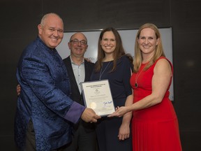 Markham Mayor Frank Scarpitti presents a Certificate of Appreciation to Frank Spaziani, Tory Stollery and Cailey Stollery of Kylemore Communities.
