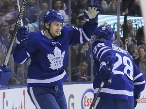 Maple Leafs winger Connor Brown (28) celebrates with teammate James van Riemsdyk in Toronto on Monday February 12, 2018. (Veronica Henri/Toronto Sun)
