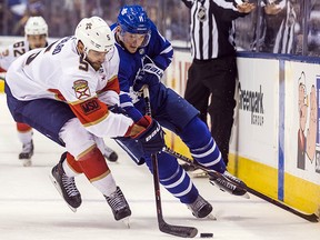 Toronto Maple Leafs forward Zach Hyman battles with Florida Panthers defenceman Aaron Ekblad at the Air Canada Centre in Toronto on Tuesday February 20, 2018. (Ernest Doroszuk/Toronto Sun)