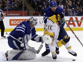 Maple Leafs goaltender Frederik Andersen (31) looks for the puck as teammate Ron Hainsey battles with Predators forward Viktor Arvidsson at the Air Canada Centre in Toronto on Wednesday, February 7, 2018. (Stan Behal/Toronto Sun)