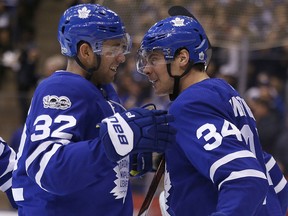 Josh Leivo (left) and Auston Matthews celebrate after the Maple Leafs scored against the Philadelphia Flyers at the Air Canada Centre in Toronto on Thursday October 26, 2017. (Michael Peake/Toronto Sun)