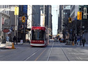 Besides streetcars, King St. was empty near Maki My Way Custom Sushi at 293 King St. West on Feb. 2, 2018. (Dave Abel, Toronto Sun)