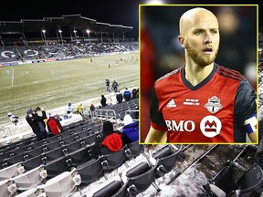 With temperatures in the single digits (Fahrenheit), a sparse crowd watches Toronto FC play the Colorado Rapids during the first half of a CONCACAF Champions League soccer match Tuesday, Feb. 20, 2018, in Commerce City, Colo. (AP Photo/David Zalubowski)