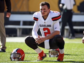 In this Nov. 15, 2015, file photo, Cleveland Browns quarterback Johnny Manziel looks on before an NFL football game against the Pittsburgh Steelers in Pittsburgh