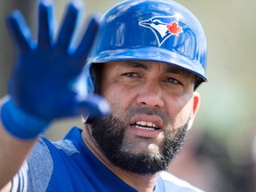 Toronto Blue Jays DH Kendrys Morales talks by the batting cage at spring training in Dunedin on Feb. 20, 2018