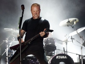 In this July 29, 2017, file photo, James Hetfield of Metallica performs during the band's concert at The Rose Bowl in Pasadena, Calif. Hetfield fell on stage during a show in Amsterdam on Monday, Sept. 5, 2017.