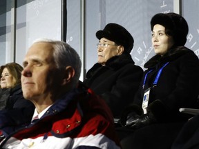 Kim Yo Jong, top right, sister of North Korean leader Kim Jong Un, sits alongside Kim Yong Nam, president of the Presidium of North Korean Parliament, and behind U.S. Vice President Mike Pence as she watches the opening ceremony of the 2018 Winter Olympics in Pyeongchang, South Korea, Friday, Feb. 9, 2018. (AP Photo/Patrick Semansky, Pool)