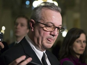 Ontario Conservative MPP Randy Hillier speaks with journalists outside the Ontario legislature in Toronto on Tuesday, February 20, 2018.