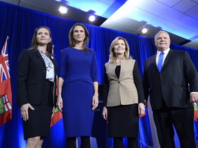 Ontario PC leadership candidates Tanya Granic Allen, Caroline Mulroney, Christine Elliott and Doug Ford pose for a photo after participating in a debate in Ottawa on Wednesday, Feb. 28, 2018. (THE CANADIAN PRESS/PHOTO)