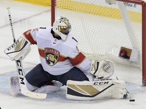 Florida Panthers goalie Roberto Luongo deflects the puck during the third period of an NHL hockey game against the New Jersey Devils Monday, Nov. 27, 2017, in Newark, N.J. The Panthers won 3-2. (AP Photo/Bill Kostroun)