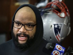 New England Patriots defensive tackle Alan Branch takes questions from reporters in the team's locker room following an NFL football practice, Wednesday, Jan. 10, 2018, at Gillette Stadium, in Foxborough, Mass. The Patriots are scheduled to host the Tennessee Titans in an NFL divisional football AFC playoff game, Saturday, Jan. 13, 2018, in Foxborough.